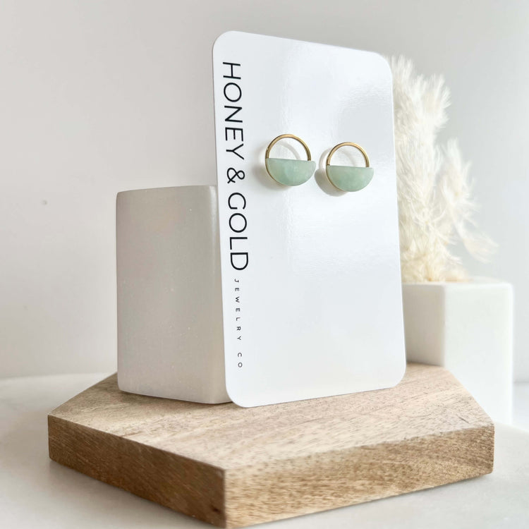 Minimalist half-moon earrings with a gold hoop accent, handcrafted from polymer clay in a variety of neutral and pastel shades.