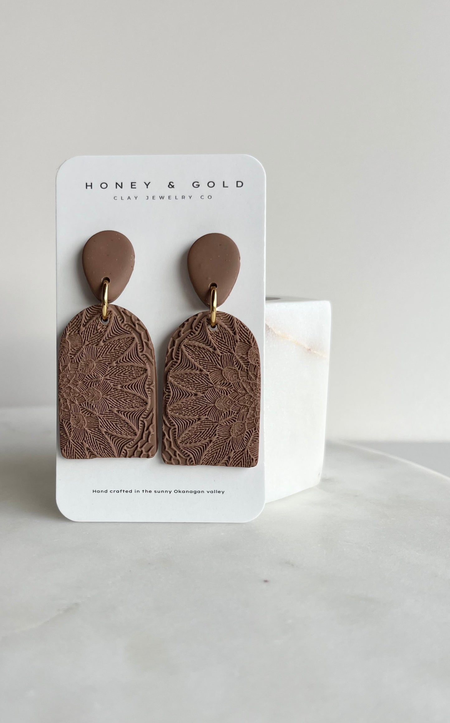 Zara drop-style earrings in a variety of velvety hues. Embellished in a mandala stamp with gold accents.