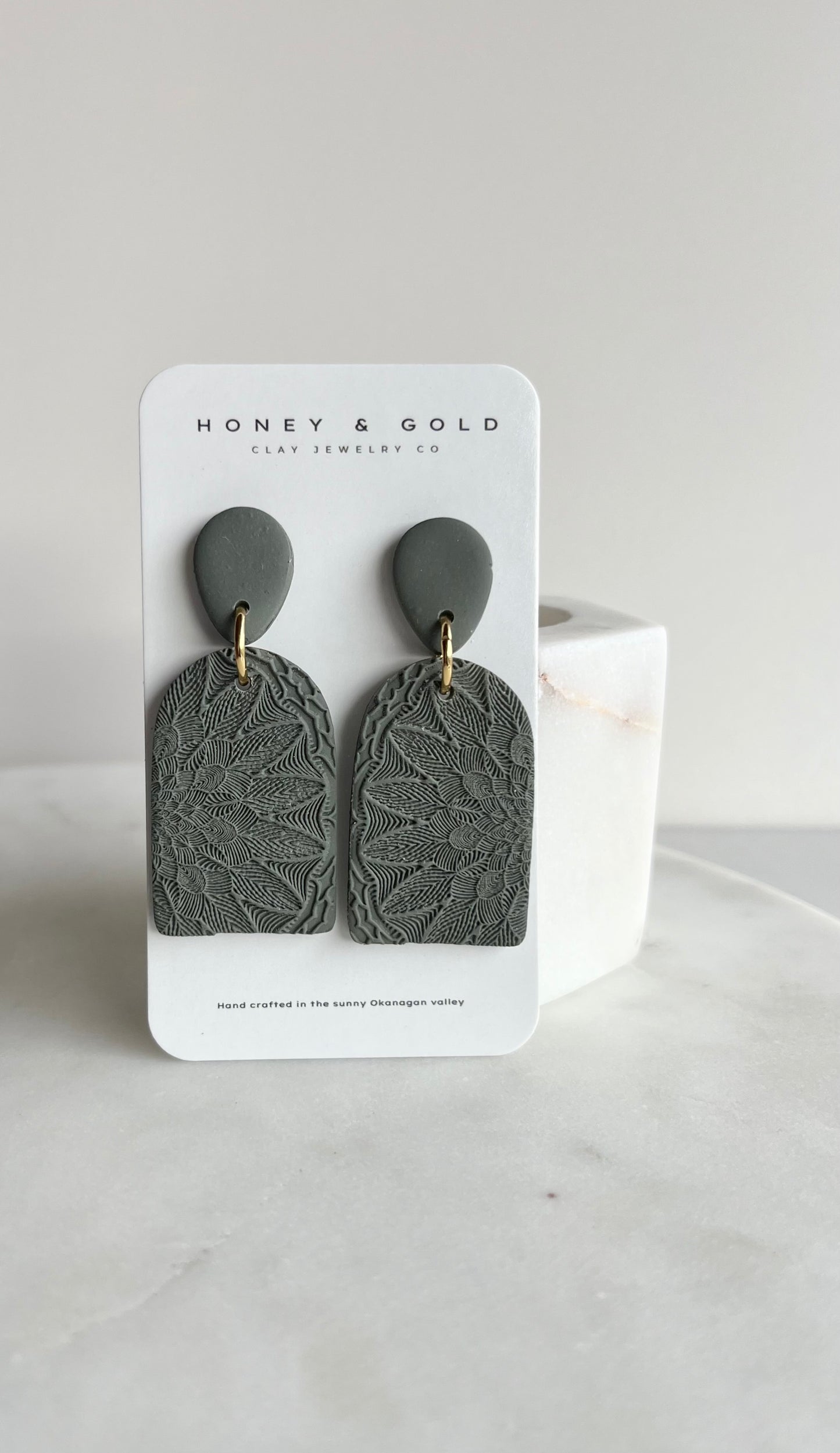 Zara drop-style earrings in a variety of velvety hues. Embellished in a mandala stamp with gold accents.
