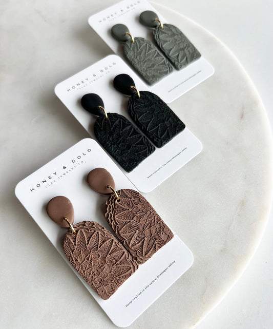 Zara drop-style earrings in a variety of velvety hues. Embellished in a mandala stamp with gold accents. 