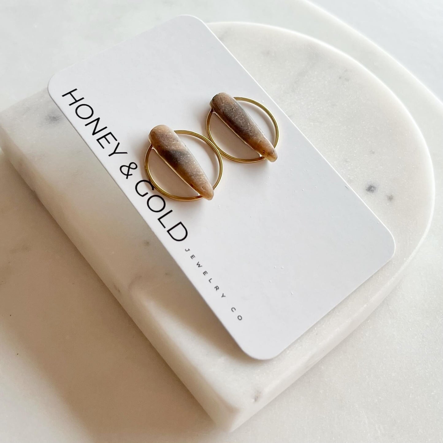 STILETTO HALO: Gold-Tone Circle Dagger Stud Earrings