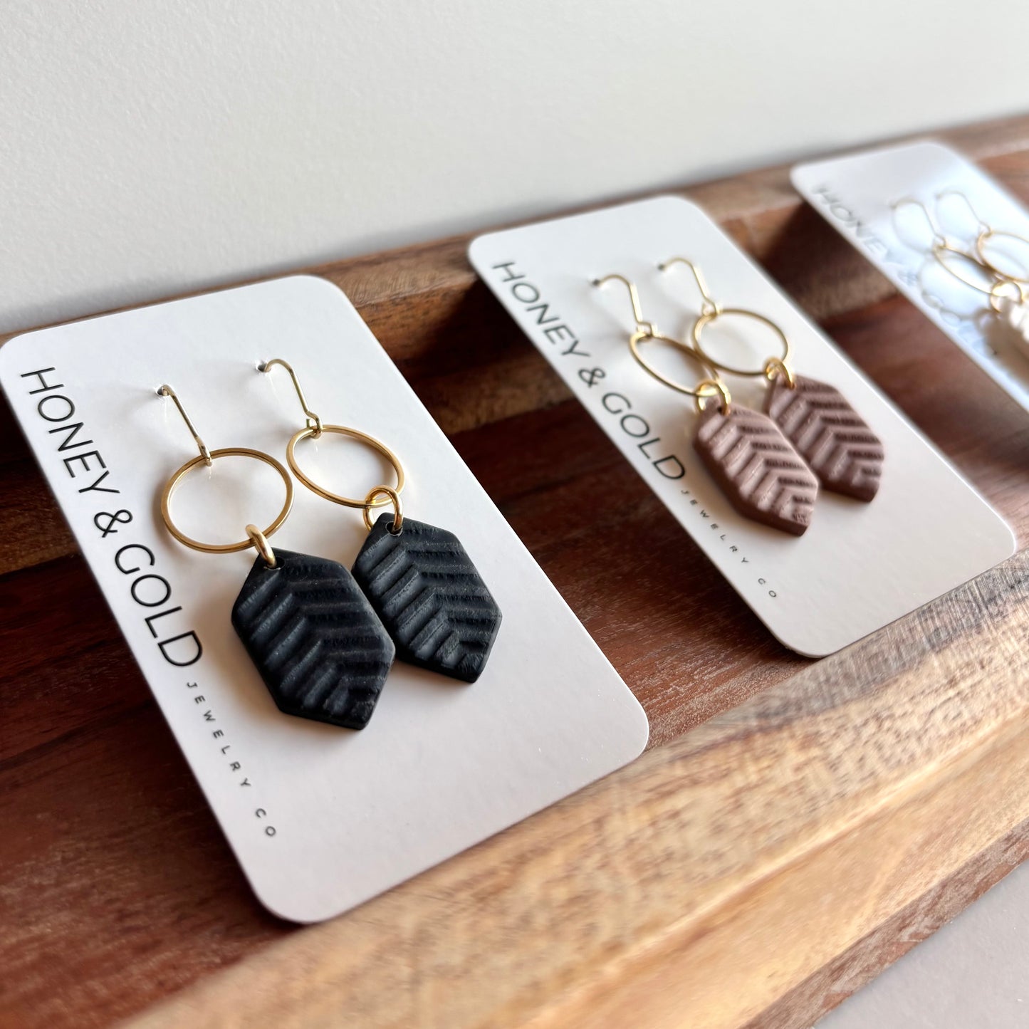 MODERN MUSE - Herringbone gold tone earrings