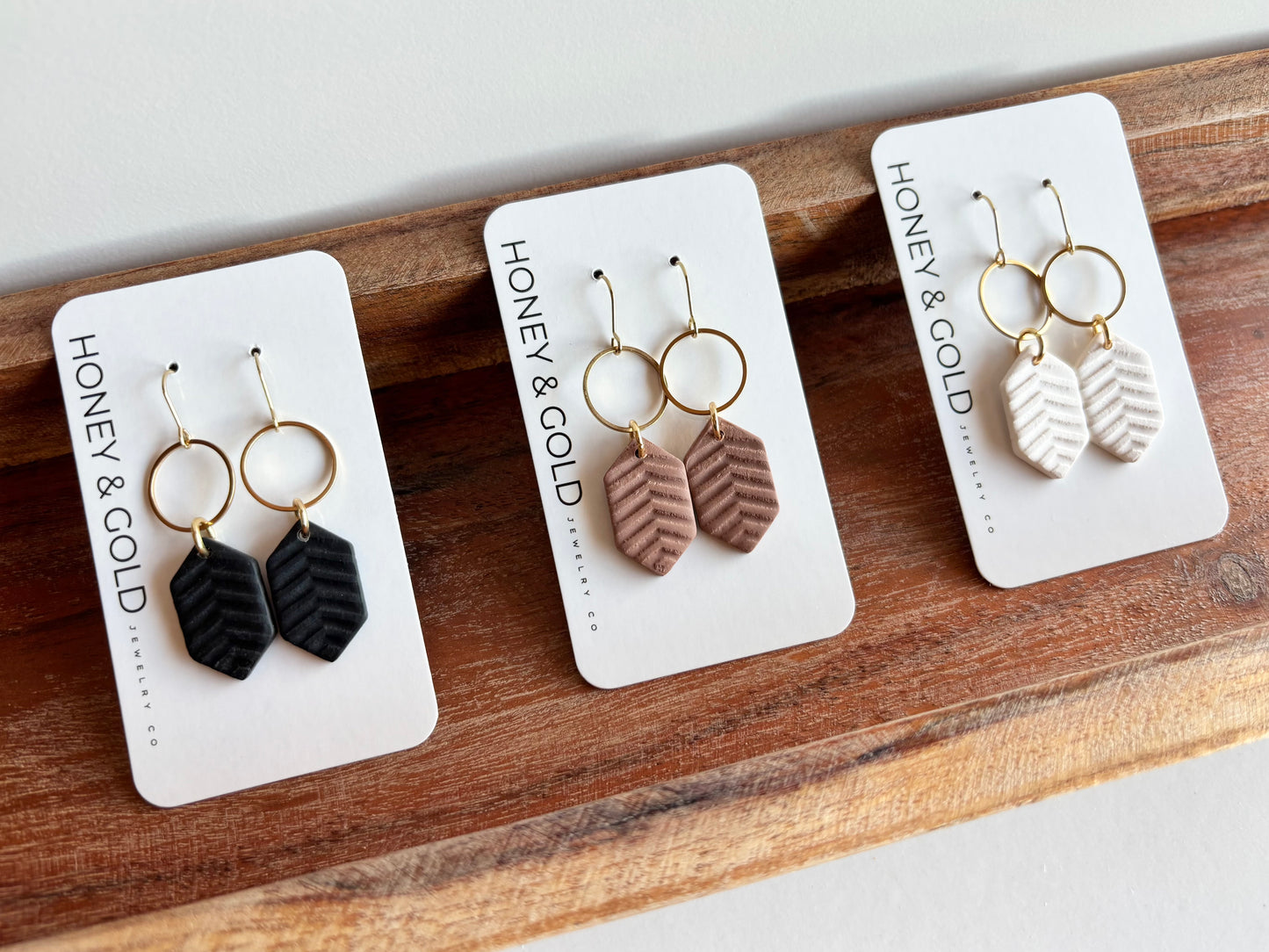MODERN MUSE - Herringbone gold tone earrings