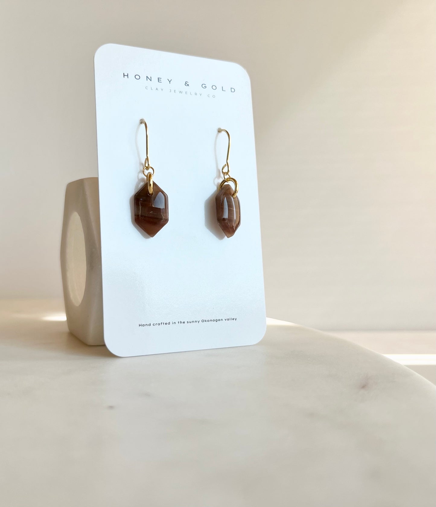 Chic drop-style earrings featuring Shadowstone, a deep, smoky faux stone with a captivating allure and sophisticated finish.