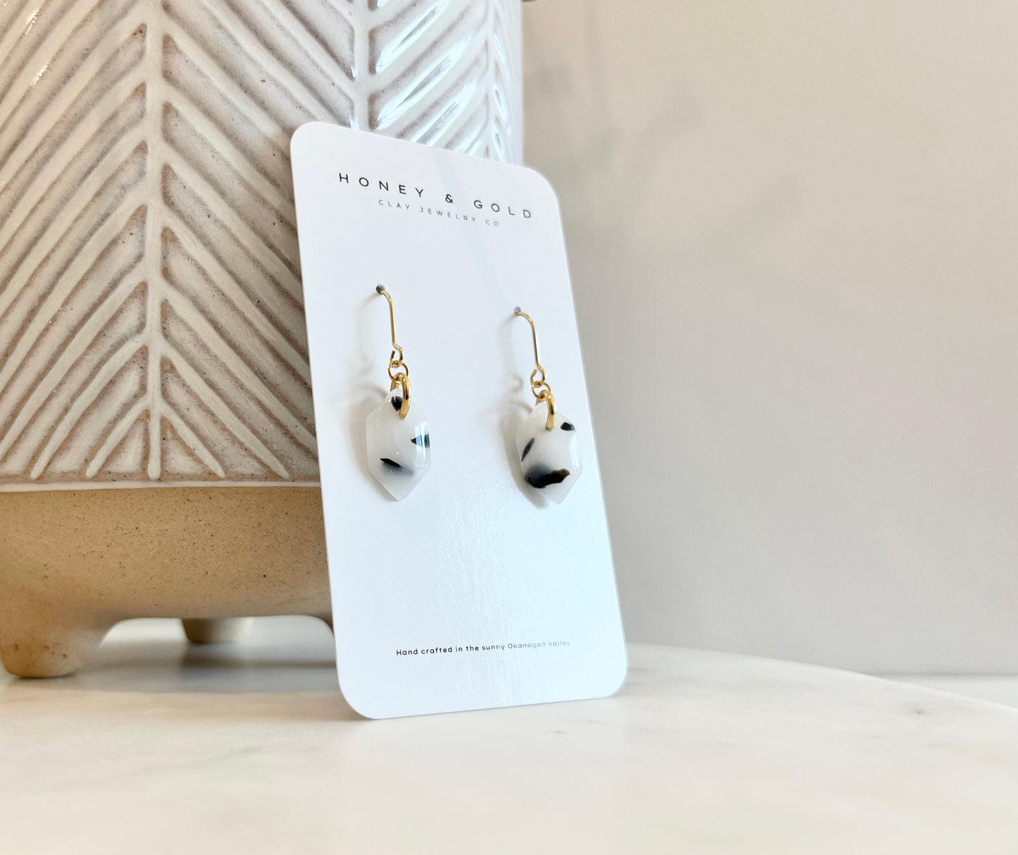 Modern drop-style earrings featuring Eclipsestone, an opaque faux stone with a striking Dalmatian look.