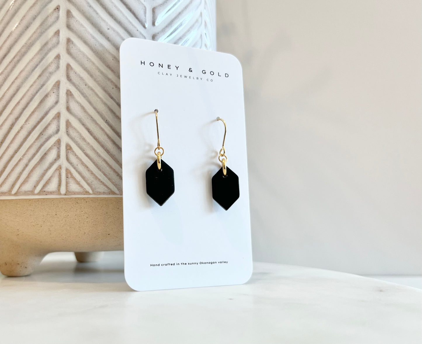 Elegant drop-style earrings featuring Sidionstone, a luxurious faux obsidian stone with an intense black sheen and smooth surface.