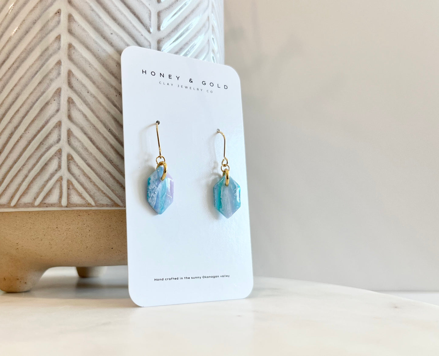 Stunning drop-style earrings featuring Aurorastone, a fusion of dancing northern lights teals and purples.